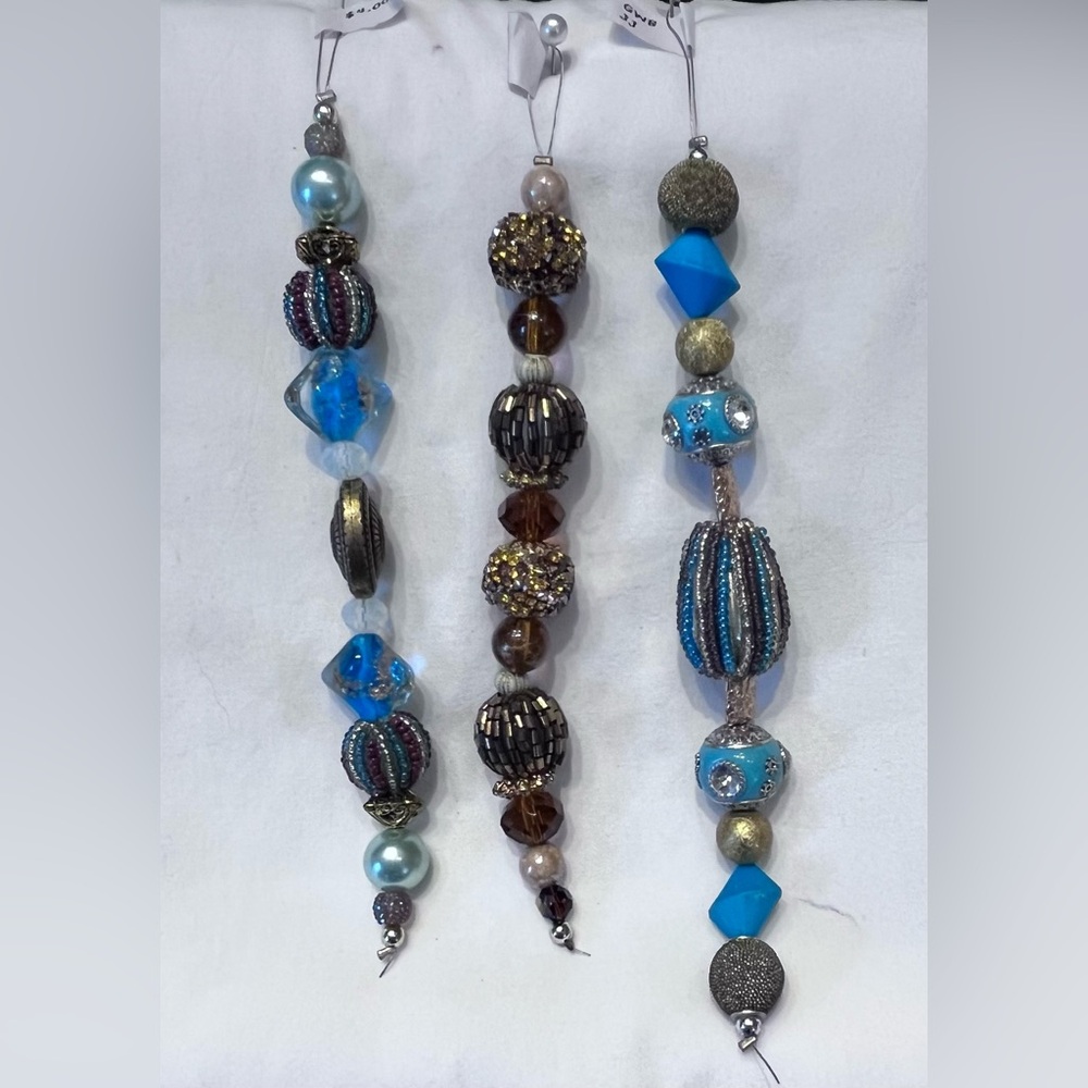 Jessie James Beads. 3 strand set. Blues, browns and brass.